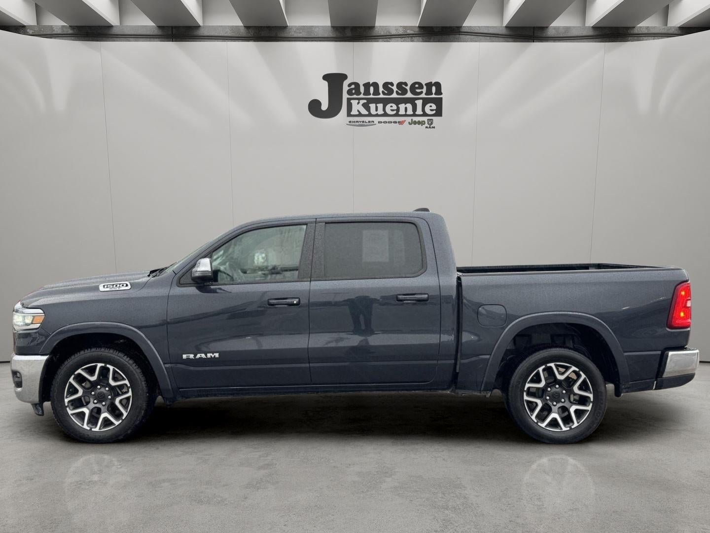 2025 RAM 1500 Laramie Crew Cab 4x4 5'7' Box in Forged Blue Metallic — front three-quarter view