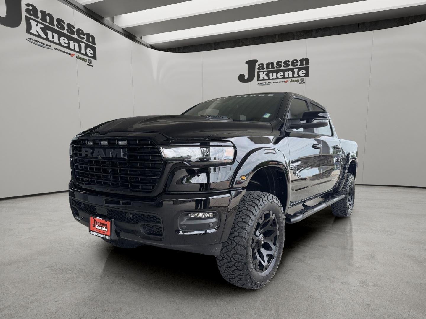 2026 RAM Ram 1500 RAM 1500 LARAMIE CREW CAB 4X4 5'7' BOX in Diamond Black Crystal Pearl-Coat Exterior Paint — front three-quarter view